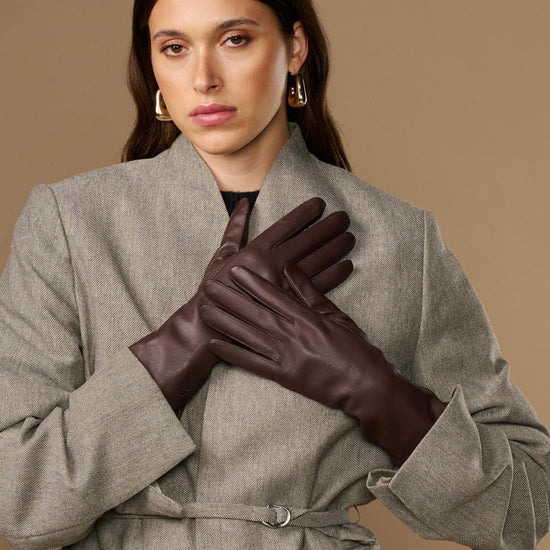 Long dark brown leather gloves with smooth, fitted design