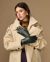 Pair of dark green leather long gloves with snug fit at the wrists