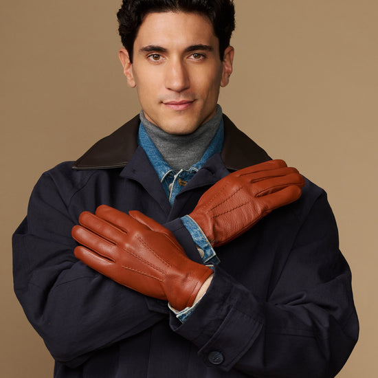 Cognac goatskin leather gloves with wool lining and touchscreen tips, shown