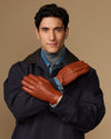 Cognac goatskin leather gloves with wool lining and touchscreen tips, shown