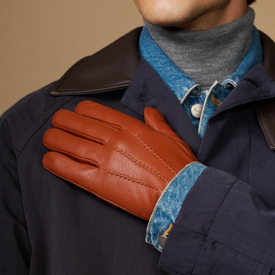 Cognac leather touchscreen glove with blue wool lining cuff, side view