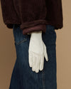 White leather glove with clean wrist seam and full hand coverage, tapered cuff