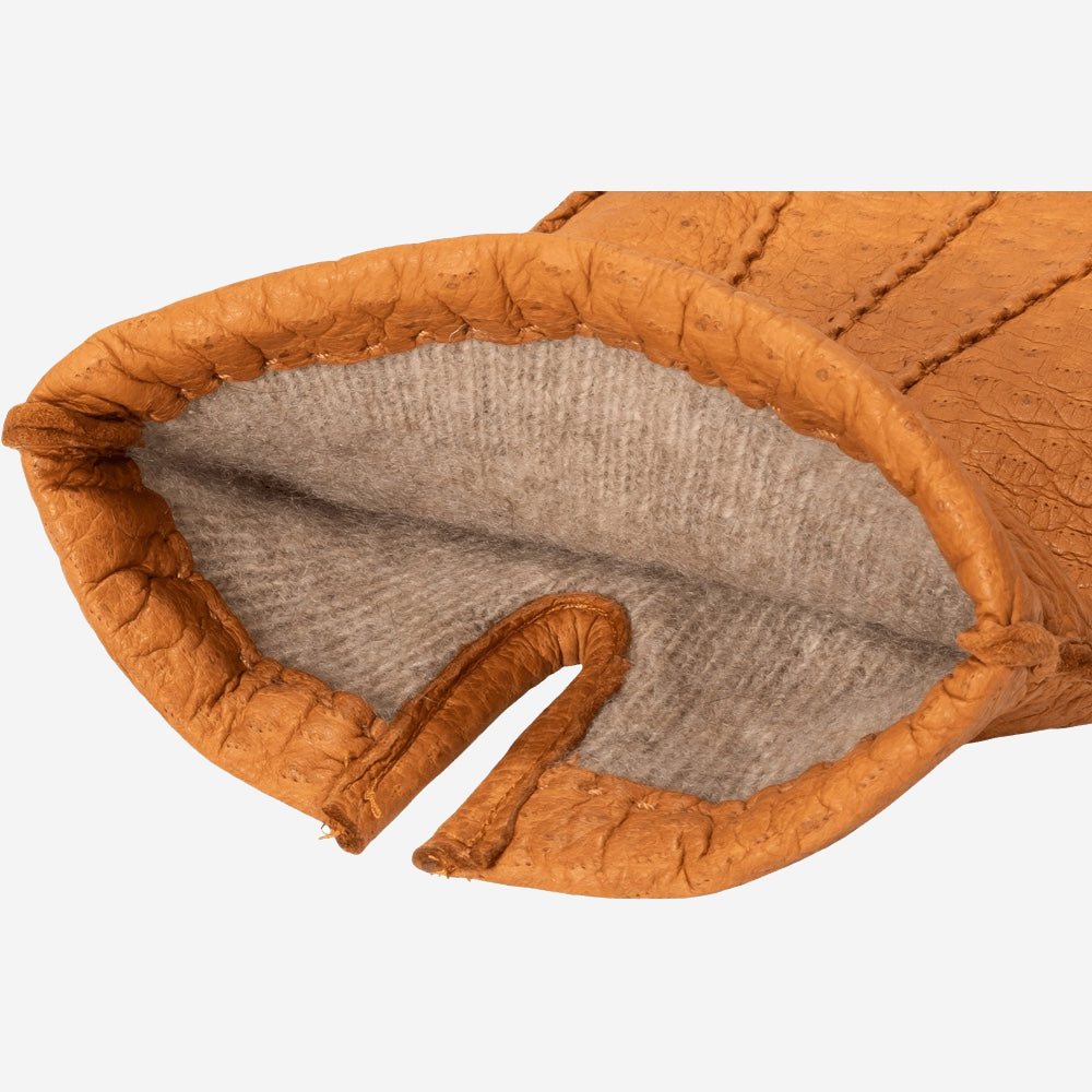 Cognac brown peccary leather glove open cuff, showing soft cashmere lining