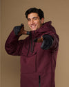 Men's quilted insulated touchscreen gloves, dark gray worn while smiling