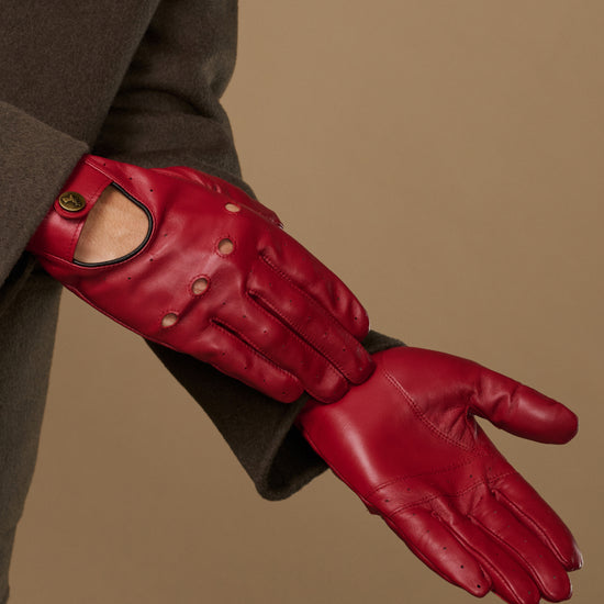 Men's red leather driving gloves, side view with open thumb and stitched knuckles
