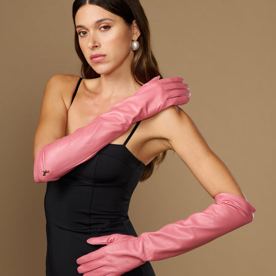 Pink lambskin elbow-length gloves with silk lining and touchscreen-ready cuffs