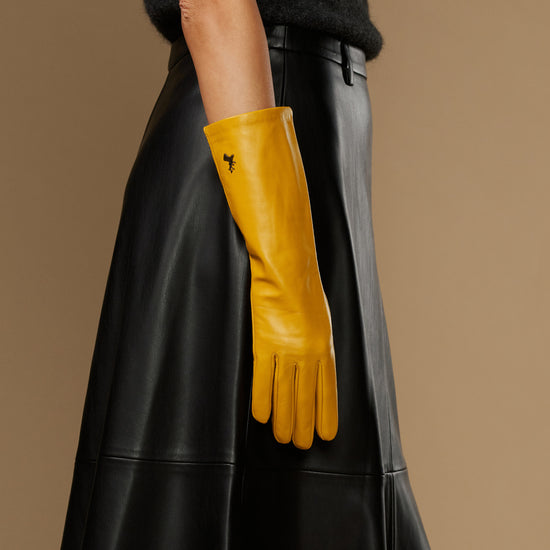 Yellow leather glove with mid-forearm cuff and clean, stitched finger detailing