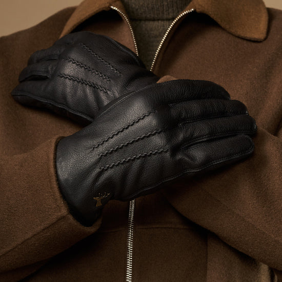 Black goatskin leather gloves, warm fleece lining detail and stitched panels
